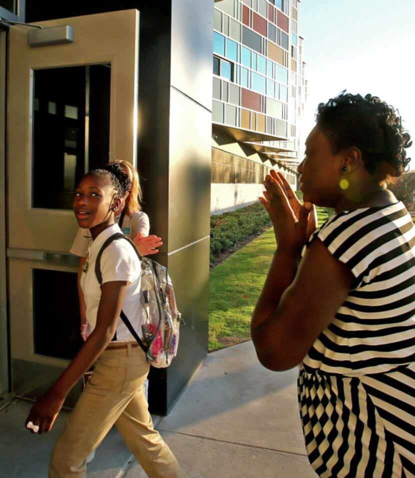 LaTasha Lewis teared up as she watched her daughter Brentavia, 12, head off to her first day...