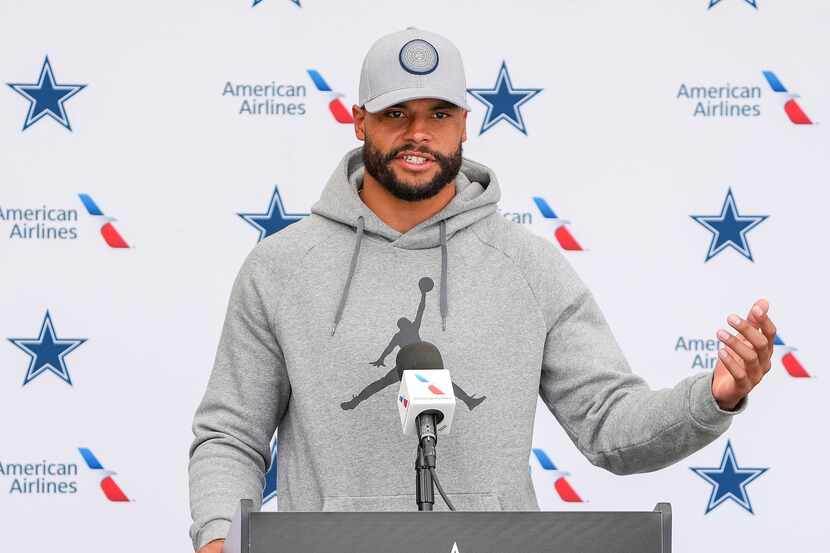 Dallas Cowboys quarterback Dak Prescott addresses reporters following a practice at training...