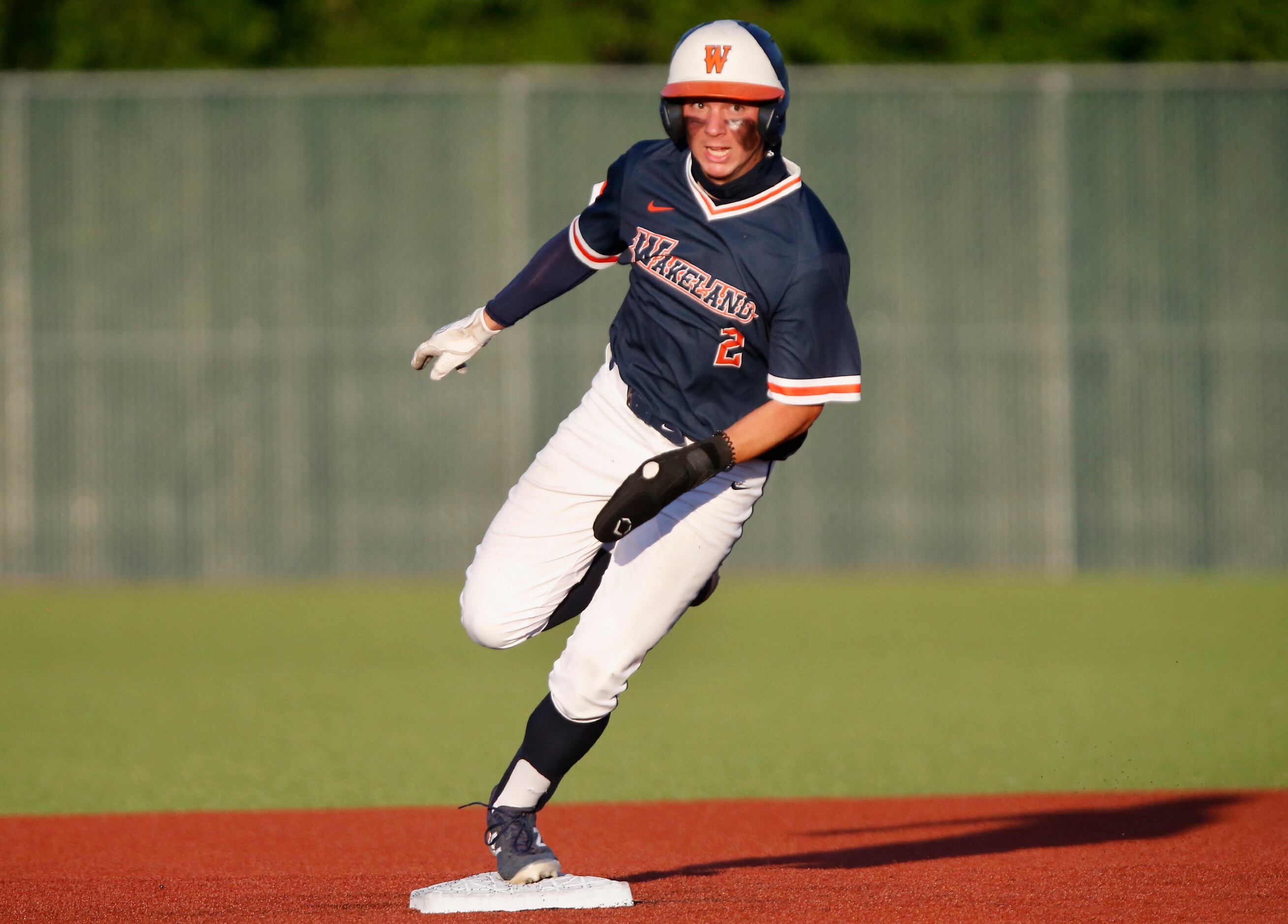 Wakeland High School right fielder Jason Young (2) rounds second and made it safely to third...