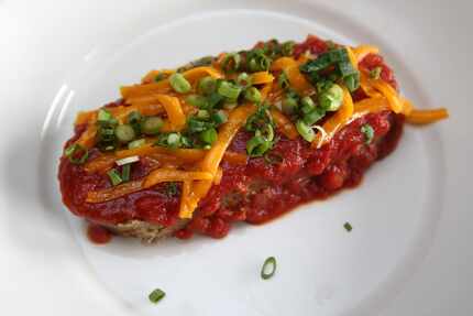 The local grass-fed meatloaf at Celebration comes with a tomato sauce, scallions and cheddar...