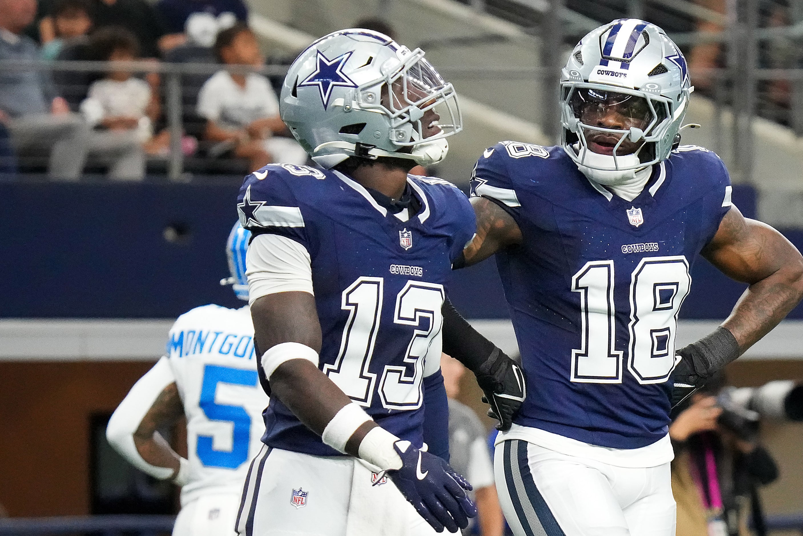 Dallas Cowboys linebackers DeMarvion Overshown (13) and Damone Clark (18) react after a...