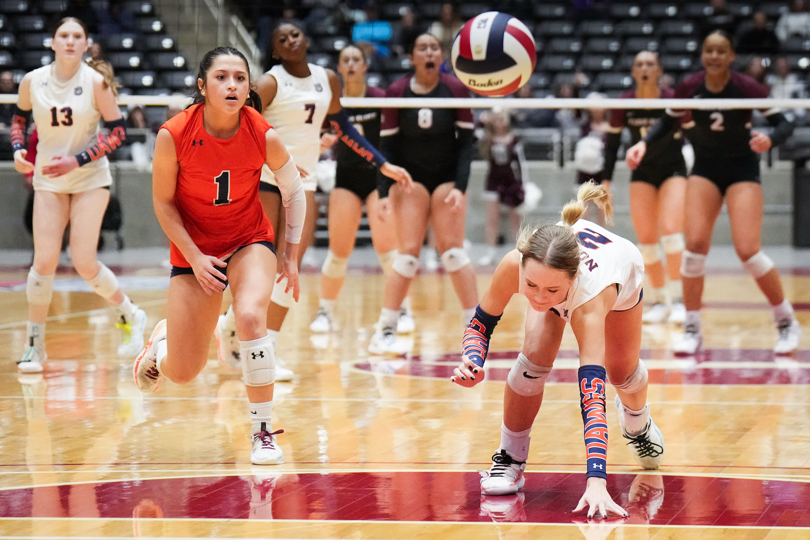 McKinney North's Gabi Rodriguez (1) and Allyn Brewer (2) can only watch as match point lands...