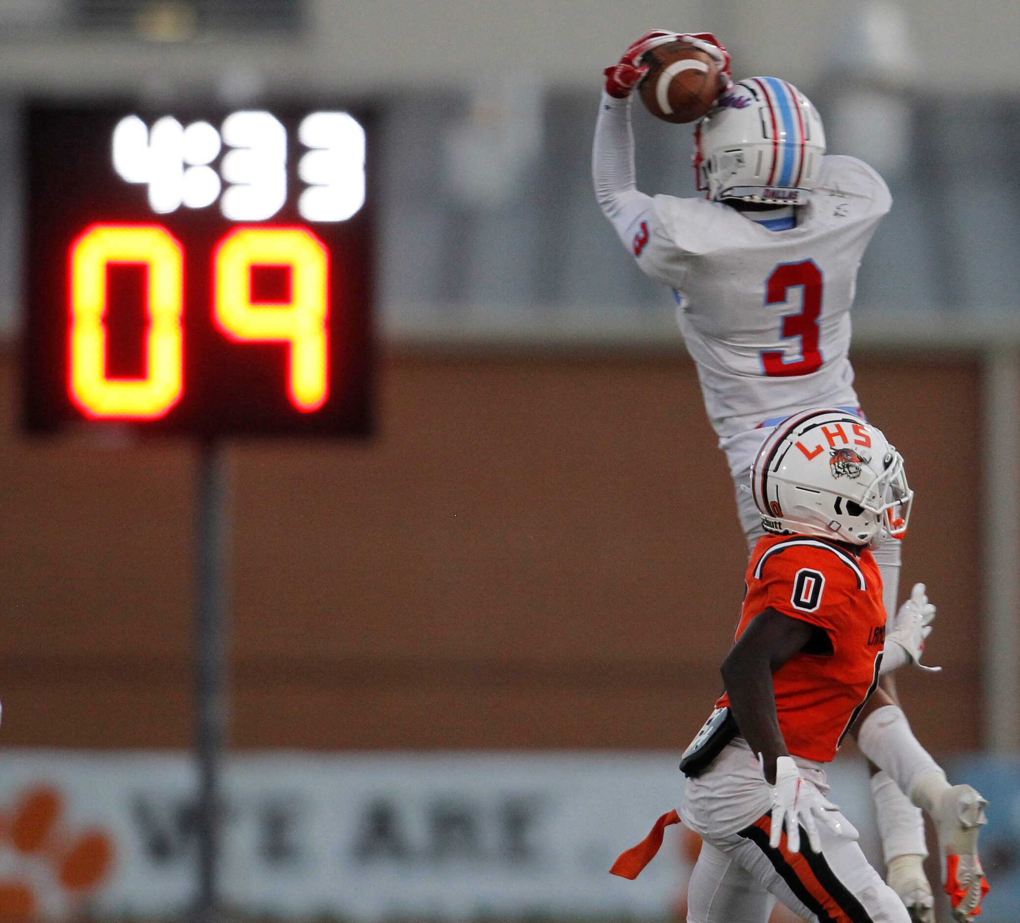 Dallas Skyline defensive back Davaontae Oliver (3) skies to intercept a pass intended for...