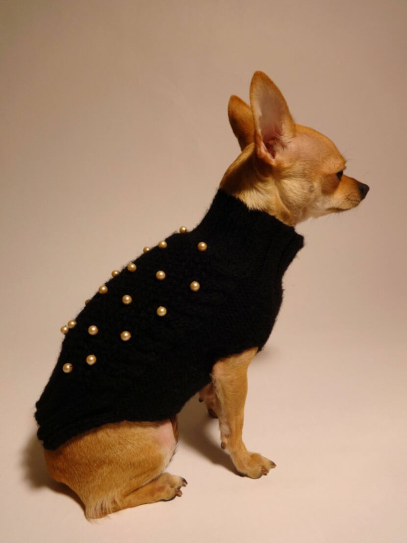 Malinche, a custom-order wool sweater with faux pearls from the Party Monster collection, is...