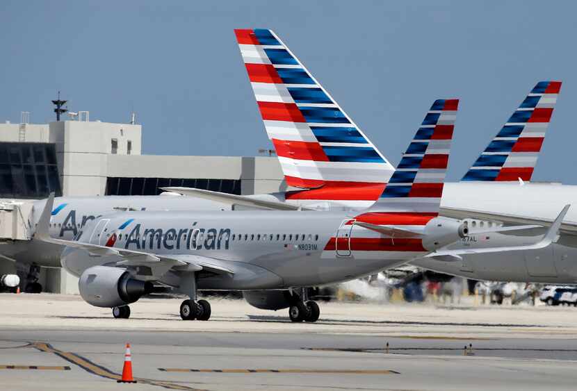 In this 2015 file photo, an American Airlines jet taxis to the gate at Miami International...