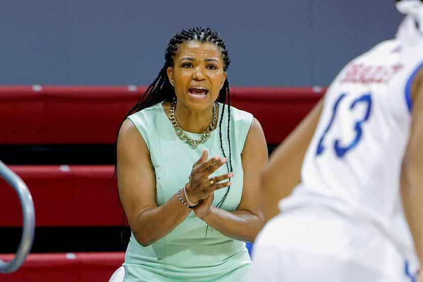 SMU head coach Toyelle Wilson cheers on the team during the first half of a game against the...
