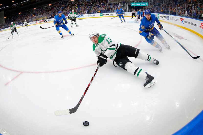 Dallas Stars' Mattias Janmark (13), of Sweden, attempts to pass the puck next ti St. Louis...