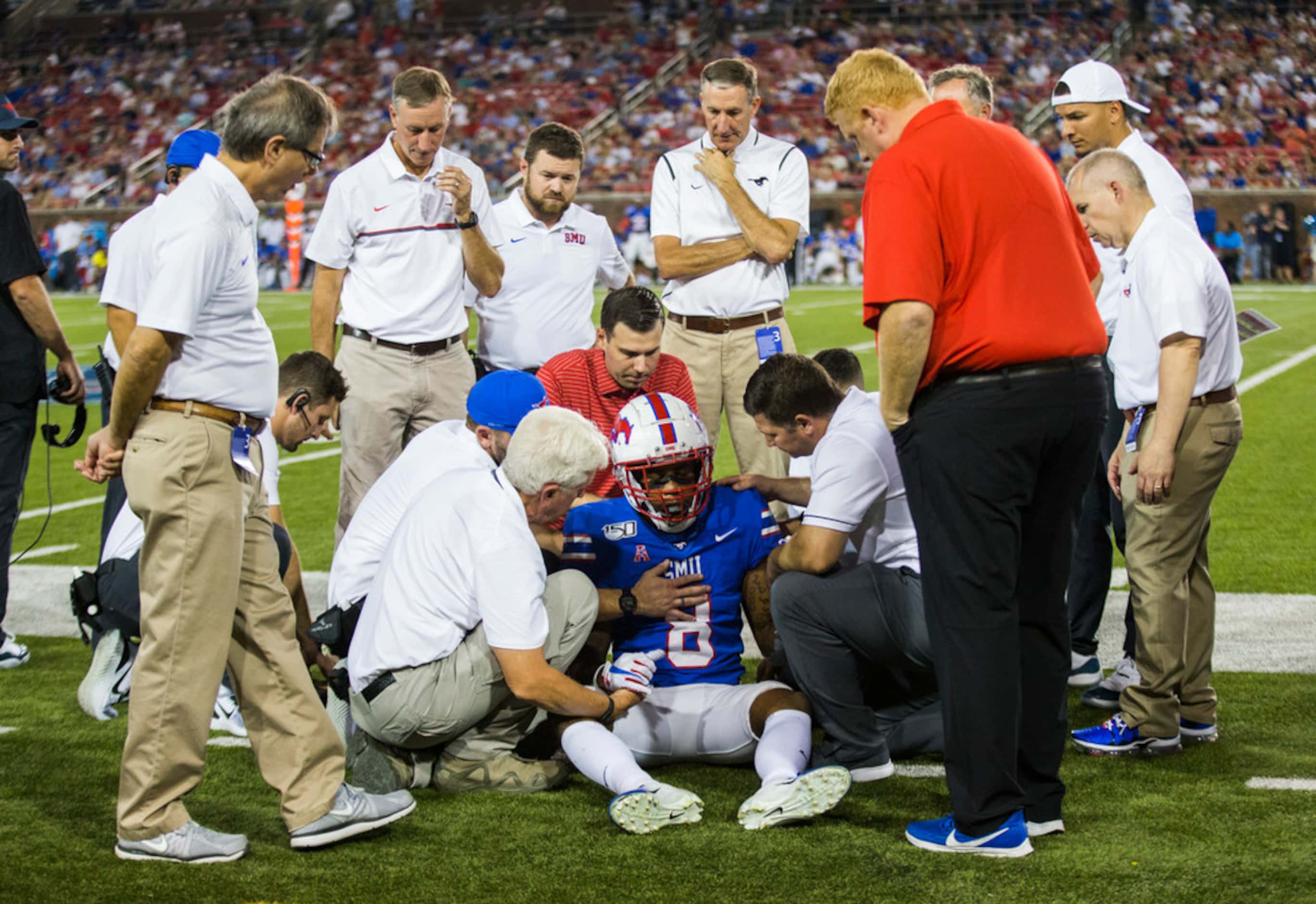 SMU Mustangs wide receiver Reggie Roberson Jr. (8) is looked at after he was hit by Tulsa...