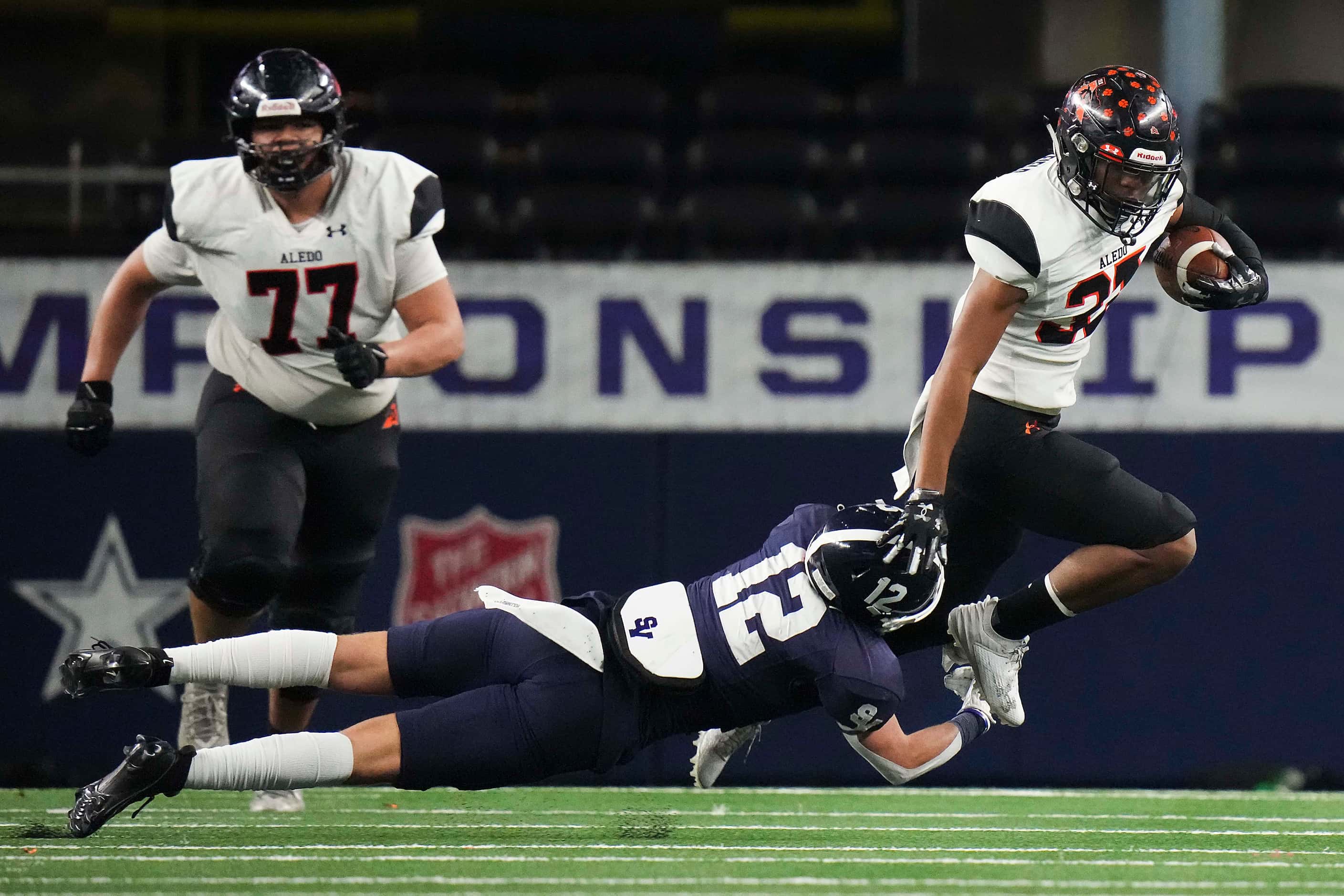 Aledo running back Kaden Winkfield (37) is tripped up by Comal Smithson Valley defensive...