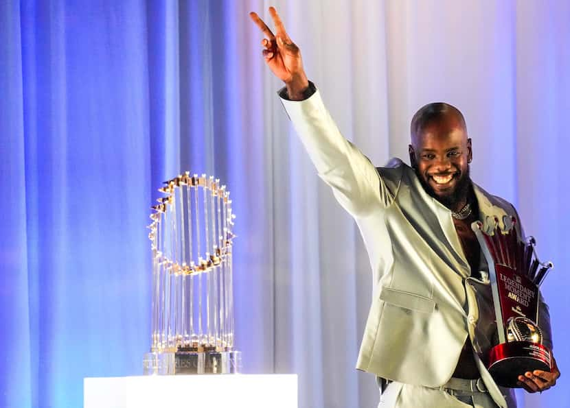 Texas Rangers right fielder Adolis Garcia accepts the 2023 MLB Budweiser Legendary Moment...