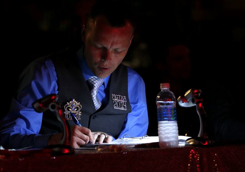 Judge Dessie Love-Blake takes notes during the Miss Gay Texas America preliminary round at...