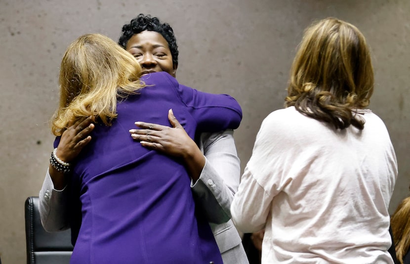 Dallas Interim City Manager Kim Bizor Tolbert (facing) is congratulated by City Council...