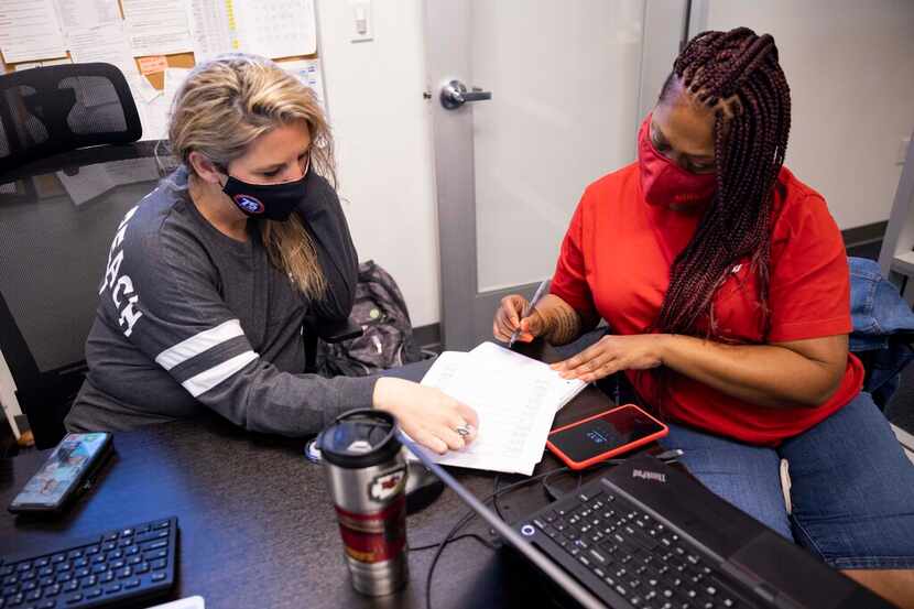 Dispatch manager Amber Ervin (left) and dispatcher Danielle Maddox work at Baker Brothers...