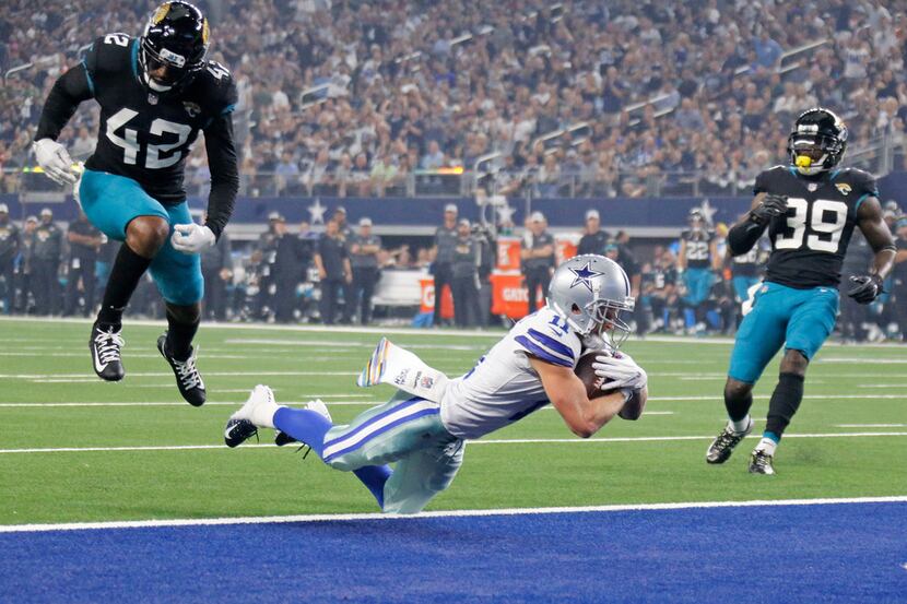 Dallas Cowboys wide receiver Cole Beasley (11)catches his first of two TD passes in front of...