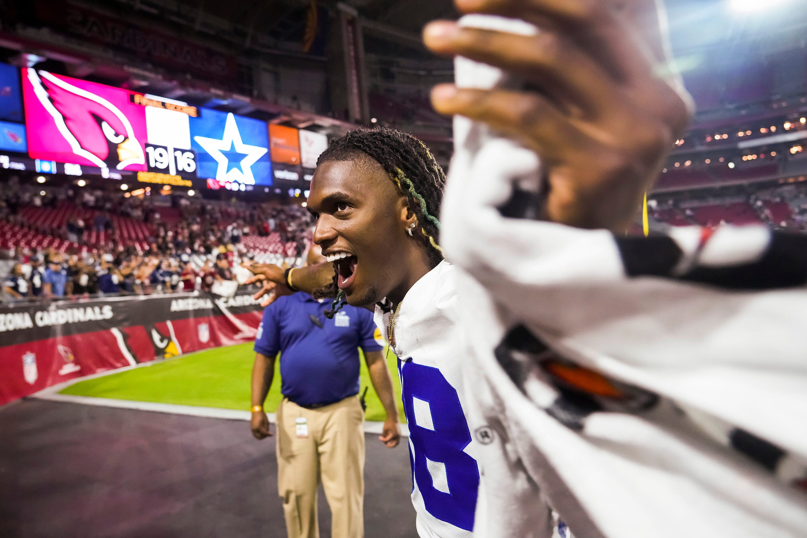 Dallas Cowboys wide receiver CeeDee Lamb waves to fans as he leaves the field after during a...