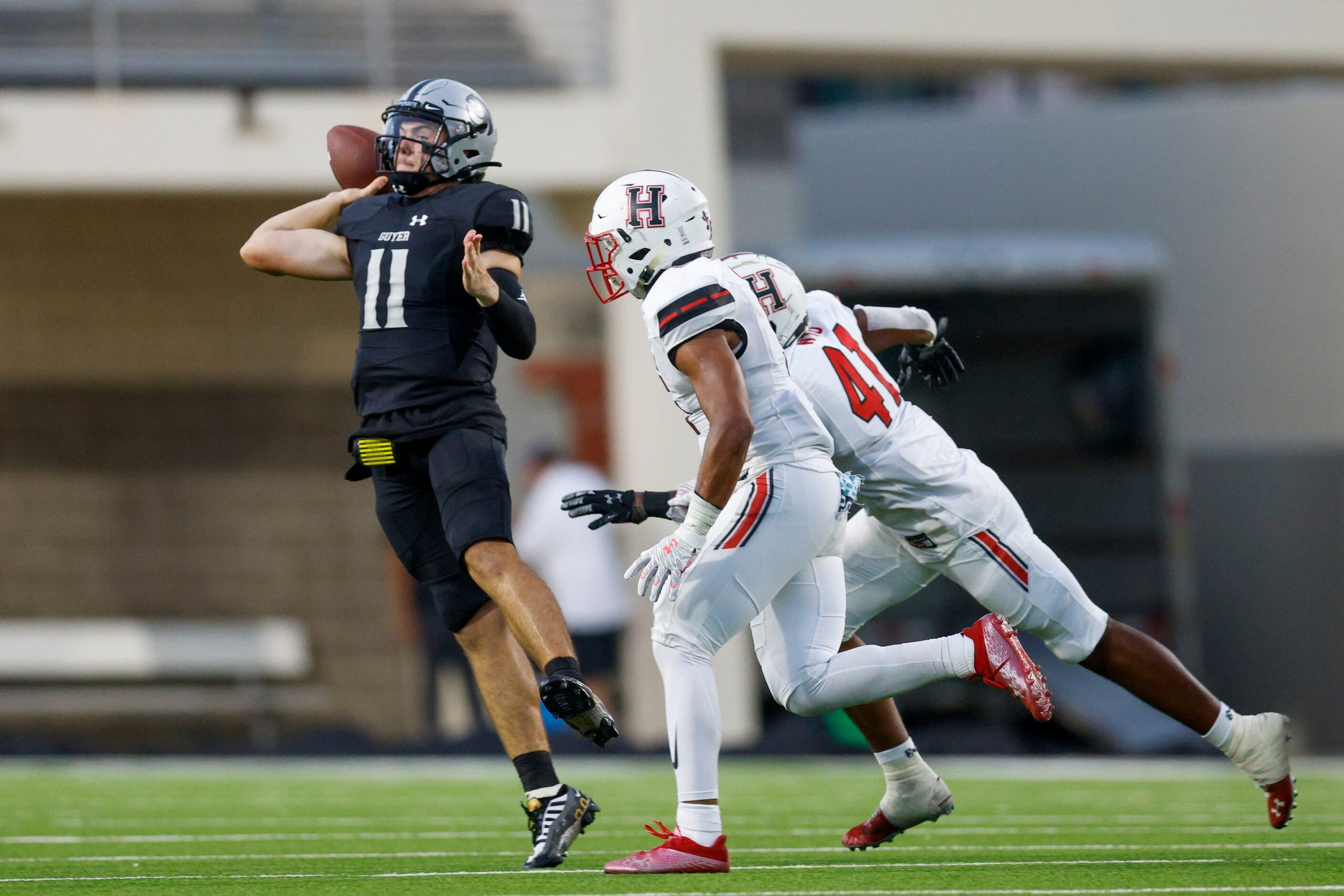 Denton Guyer quarterback Jackson Arnold (11) throws a pass while being pursued by...