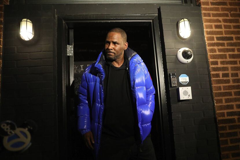 R. Kelly emerges from his studio before turning himself in to Chicago police Feb. 22, 2019.