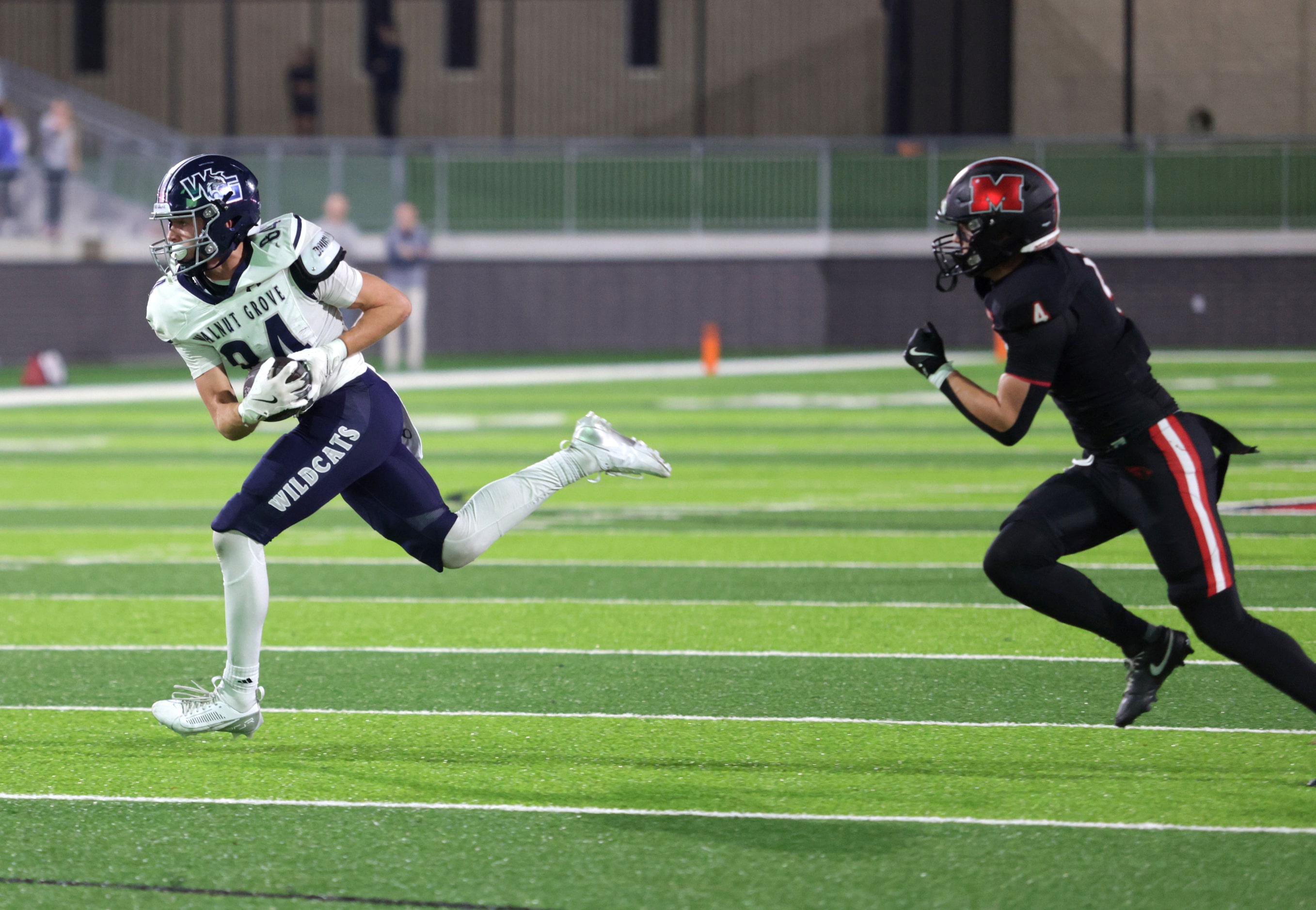 Walnut Grove player #84 Hayden Cooley attempts to outrun Melissa player #4 Max Corbin during...