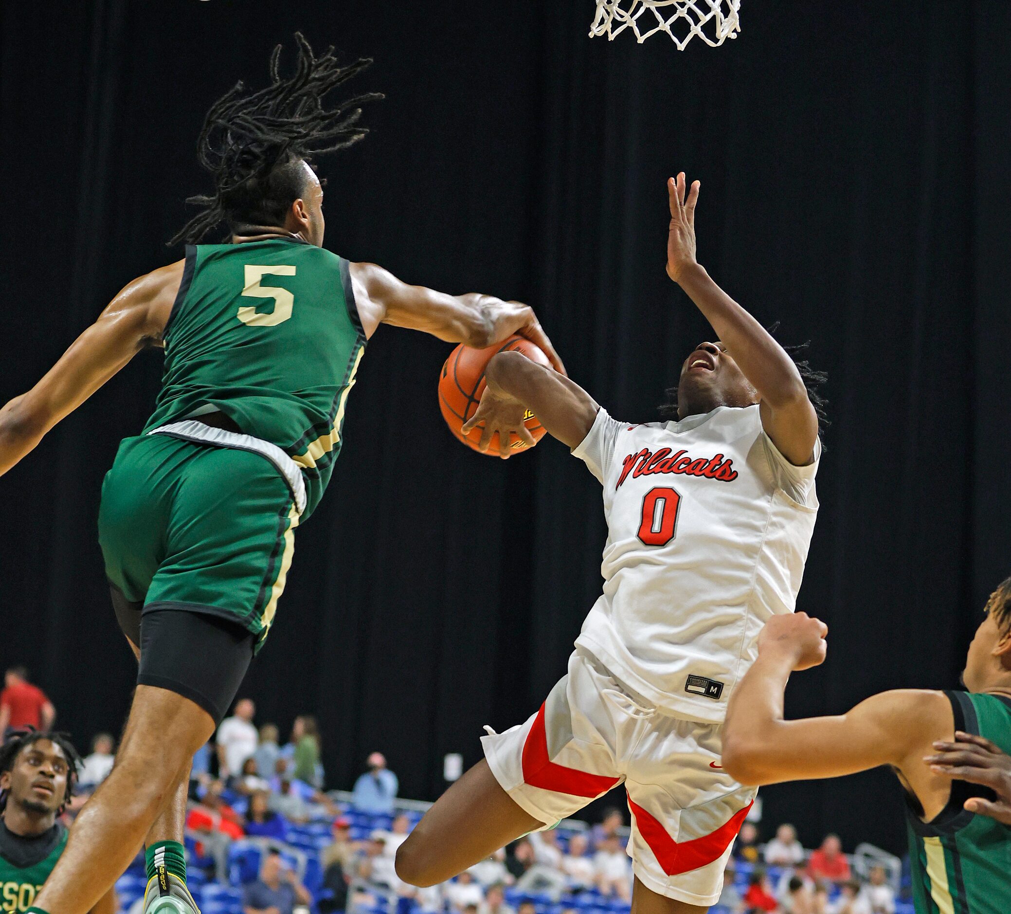 DeSoto Ahmir Wall (5) blocks the shot attempt of Richardson Lake Highlands Jaylen Washington...