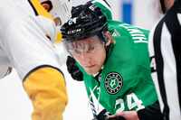 Dallas Stars center Roope Hintz (24) eyes the puck during a first period face-off with the...