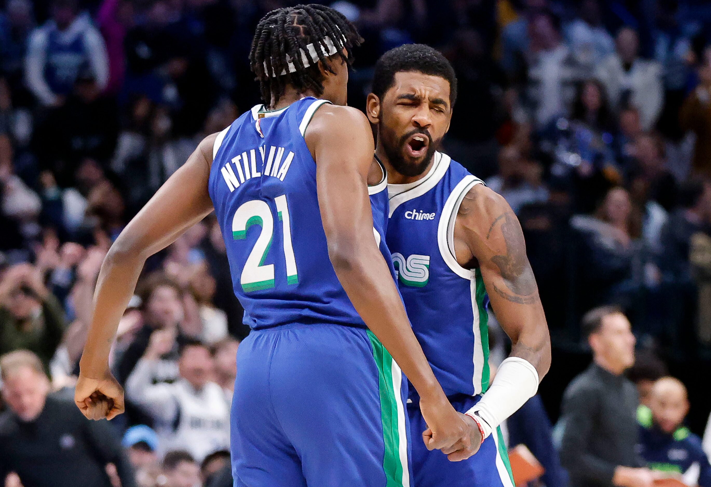 Dallas Mavericks guard Kyrie Irving (2) celebrates his fourth quarter three-pointer with...