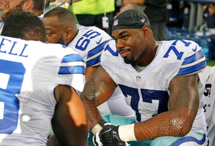 Dallas Cowboys tackle Tyron Smith (77) is pictured on the bench during the San Francisco...
