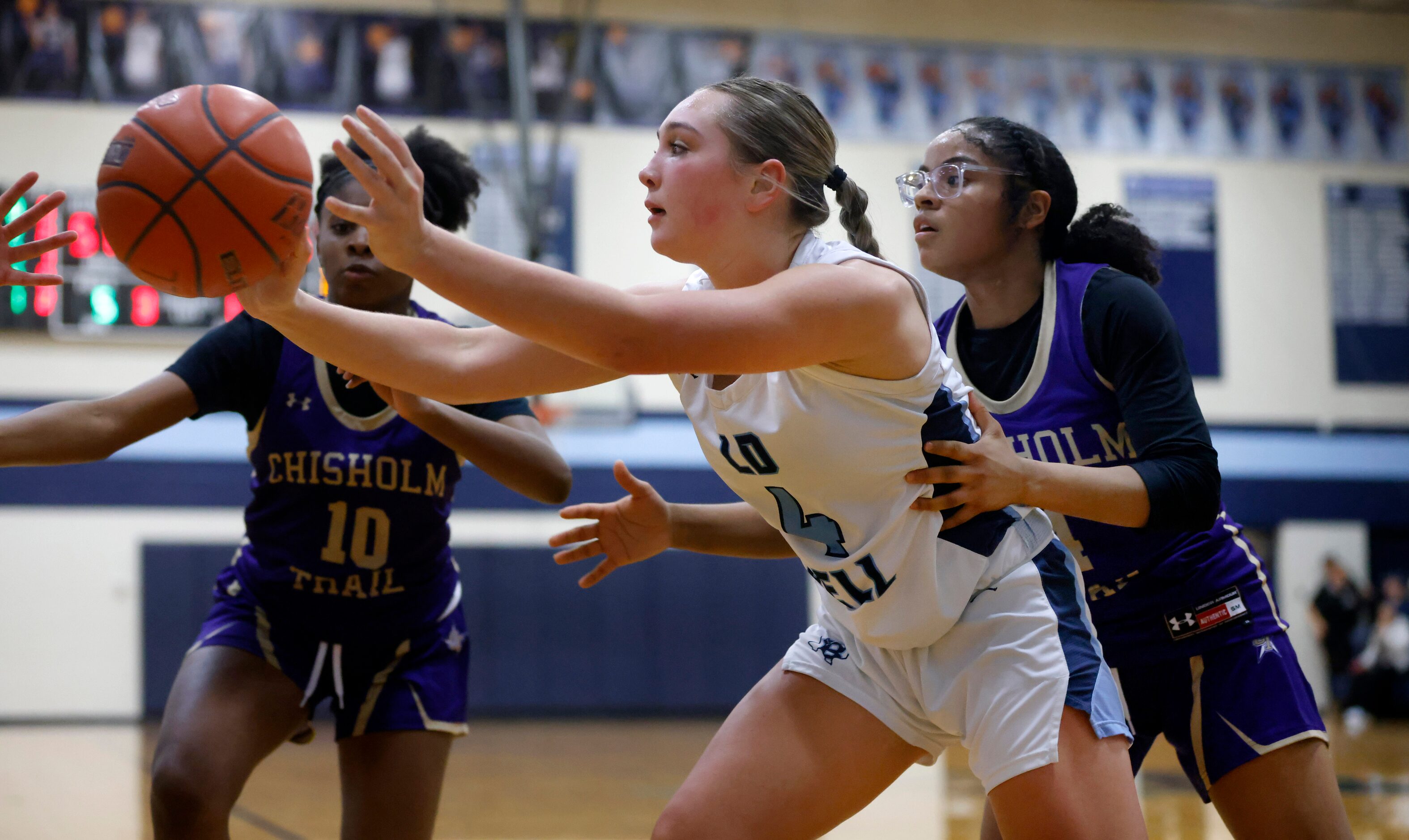 Hurst L.D. Bell’s Gracie Schwartz (4) kicks the ball out to the corner as she is covered by...