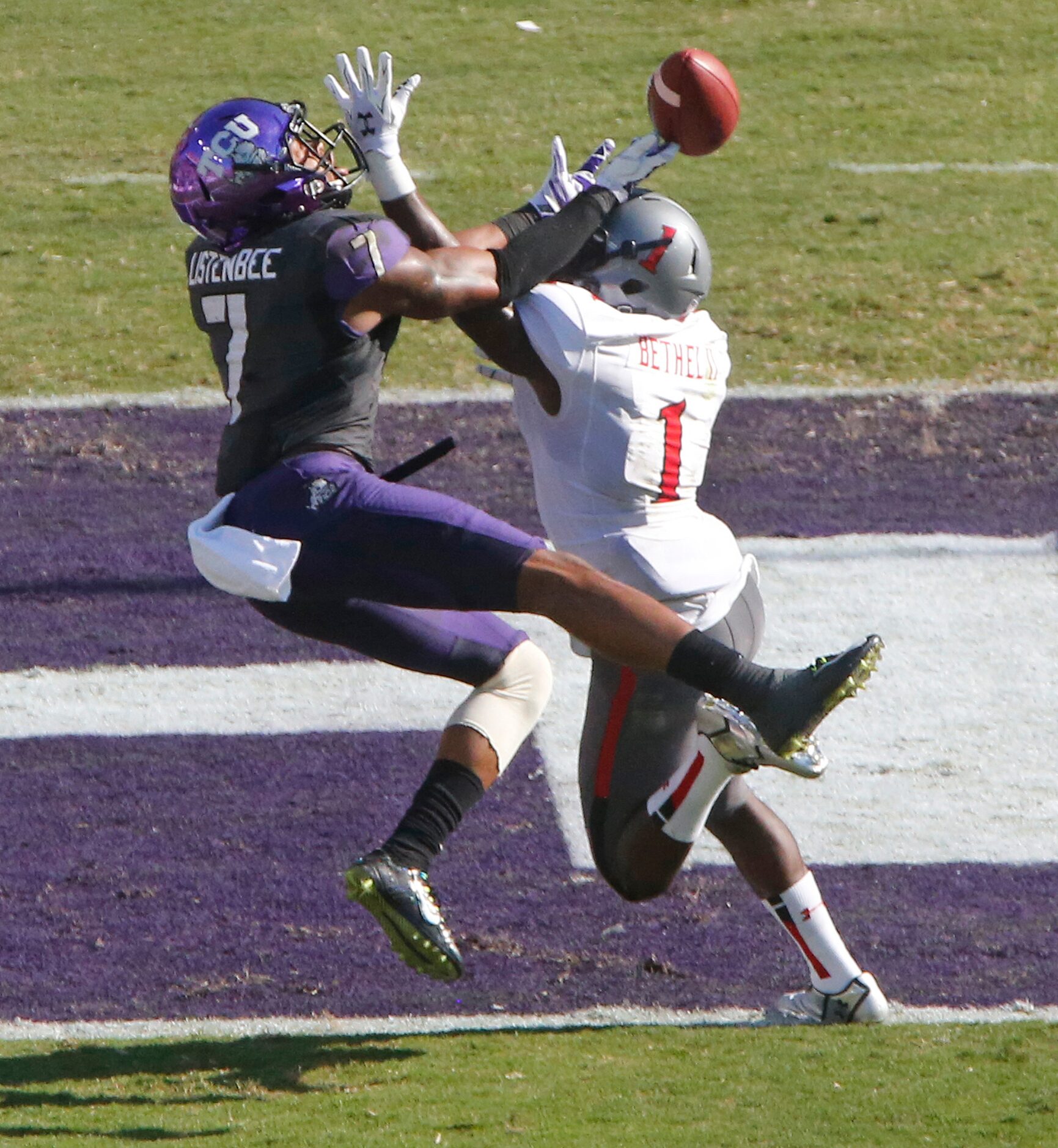 Texas Tech defensive back Nigel Bethel II (1) breaks up a pass intended for TCU wide...