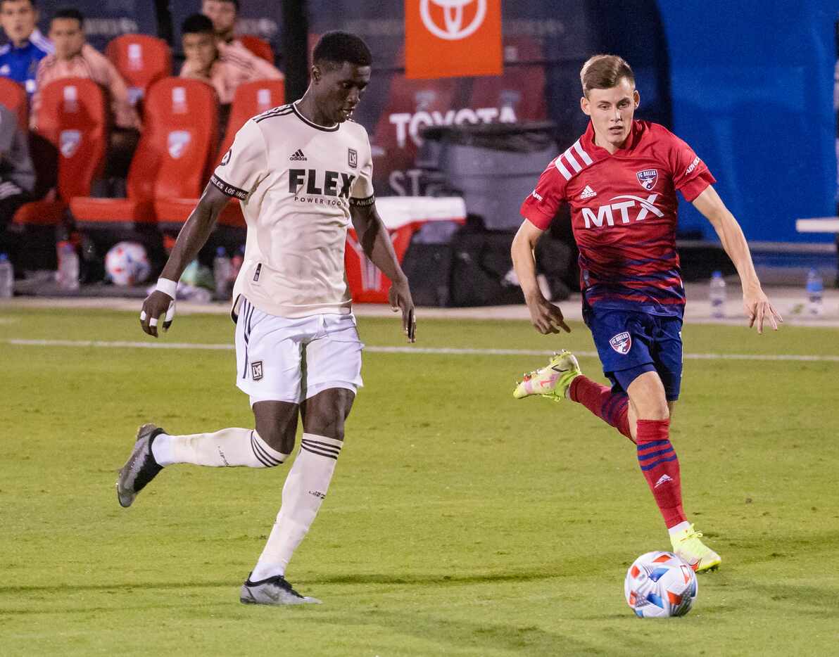 Los Angeles FC defender Mamadou Fall (5) guards FC Dallas forward Szabolcs Schön (11) during...