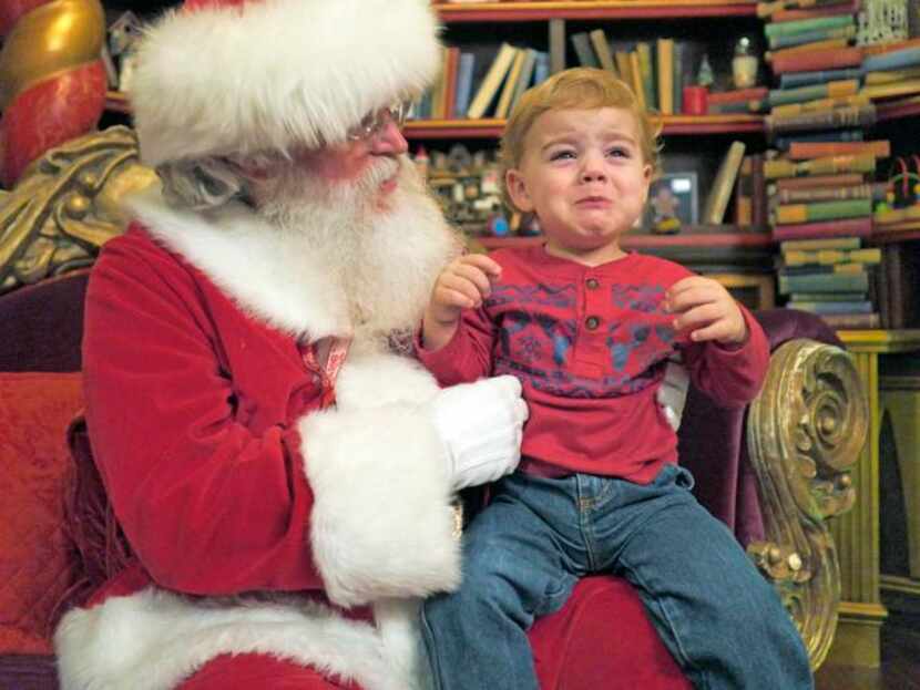 
The mood may be festive, but Matthew Jay Swinney, 23 months, can’t summon the cheer at The...