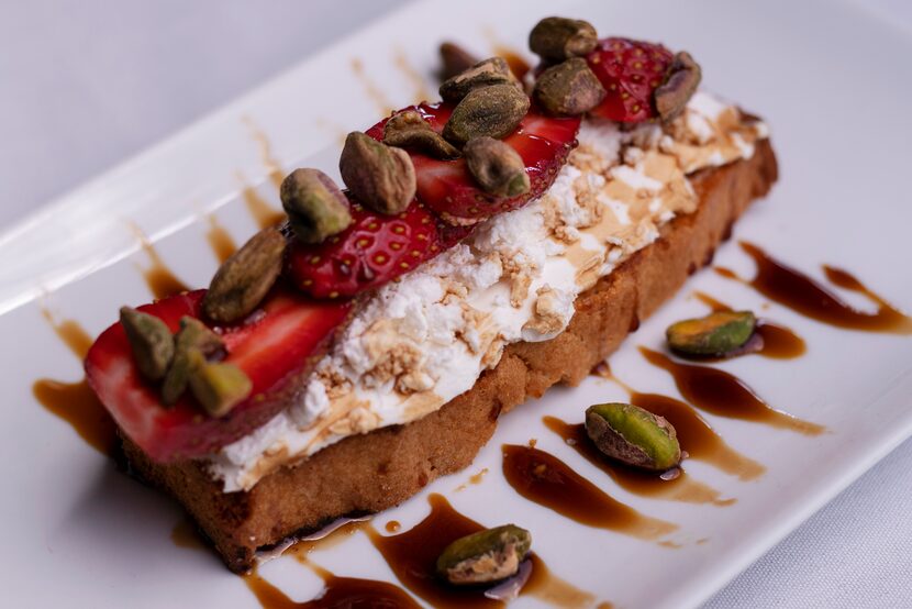 A dessert dish of housemade Kefir, Bulgarian feta, strawberries, tea rusk and roasted...