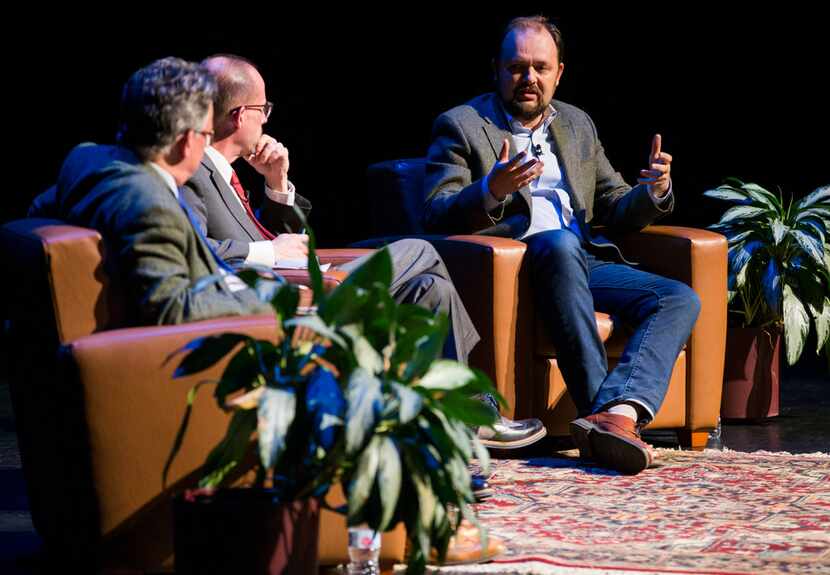 Ross Douthat (right), a columnist at The New York Times, participates in a conversation with...