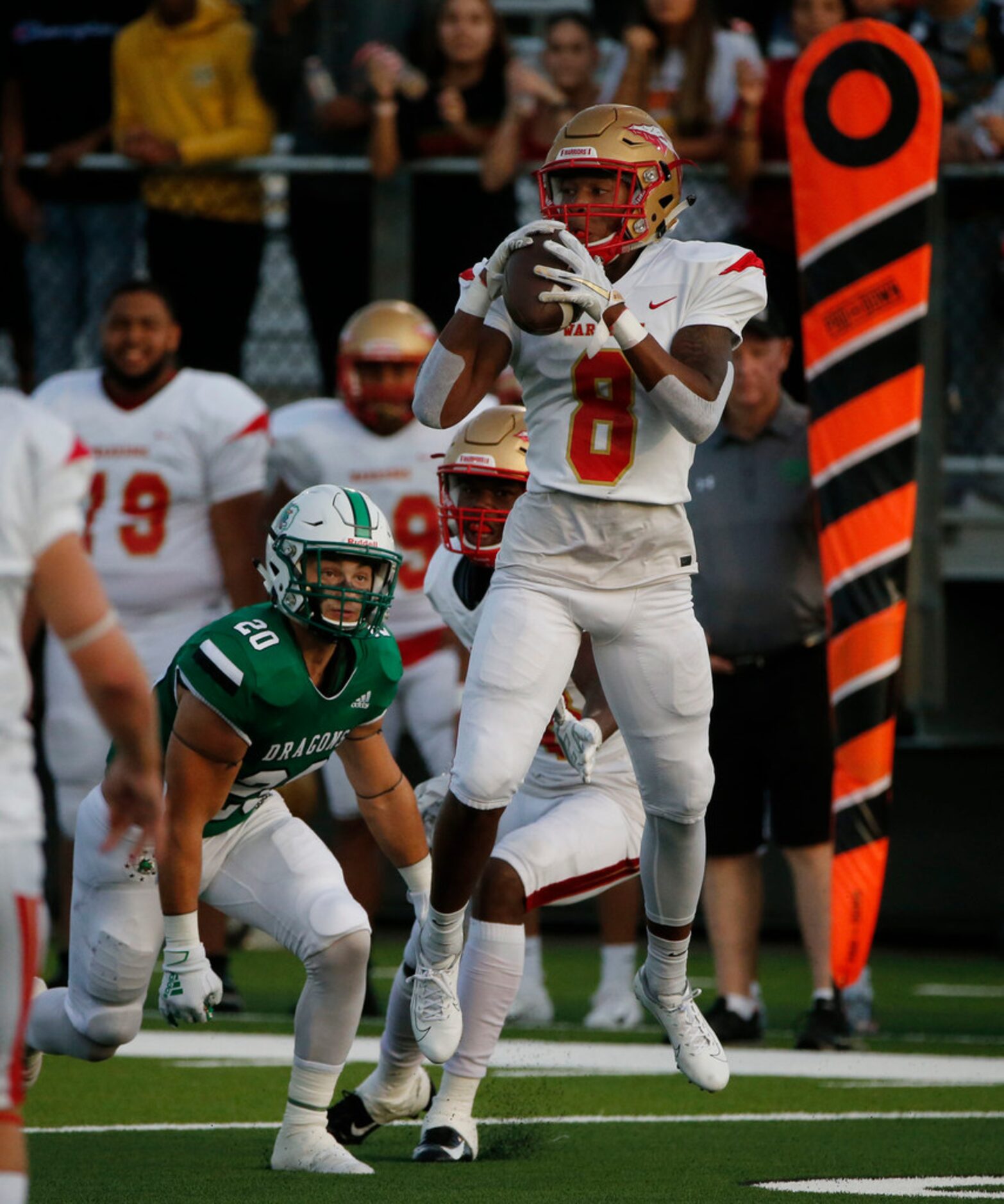 South Grand Prairie's Deamikkio Nathan (8) catches a pass in front of Southlake Carroll's...