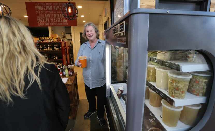 Joanne Bondy talks with customers at the Stocks and Bondy.