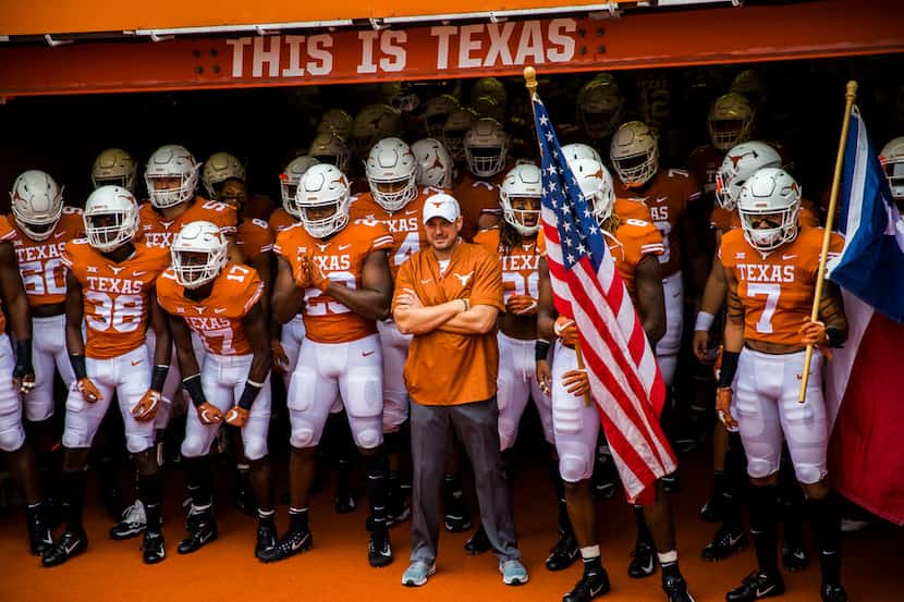 FILE - The Texas Longhorns players wait in the tunnel before a college football game between...