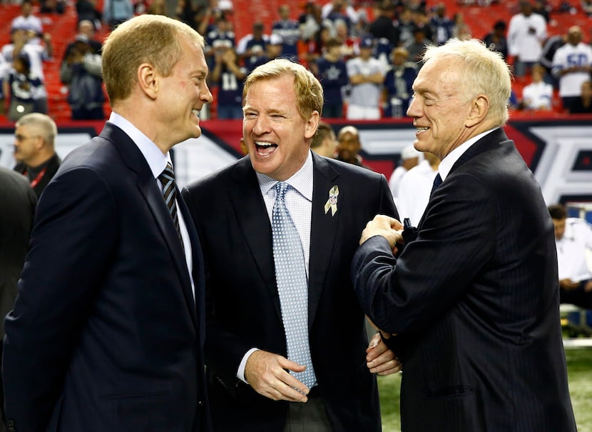 Dallas Cowboys owner Jerry Jones, right, and his son Jerry Jones Jr. laugh with NFL...