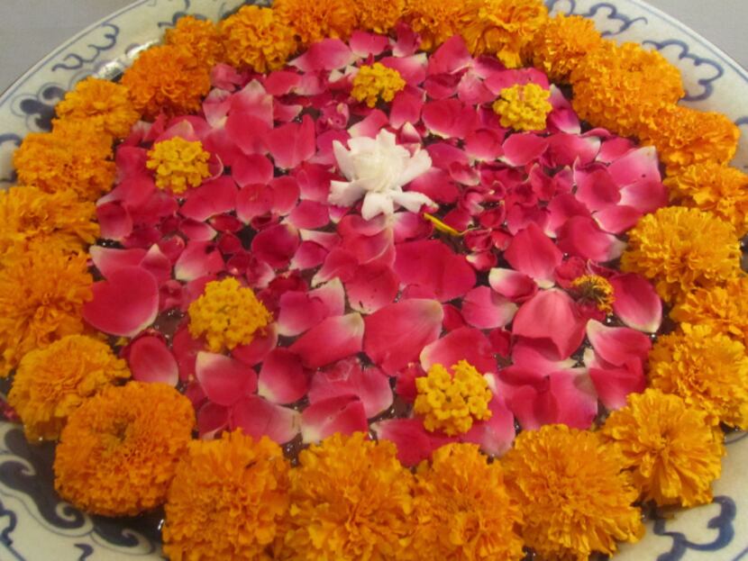 Bowls of marigolds make up a welcome puja, an offering often made to both the gods and...