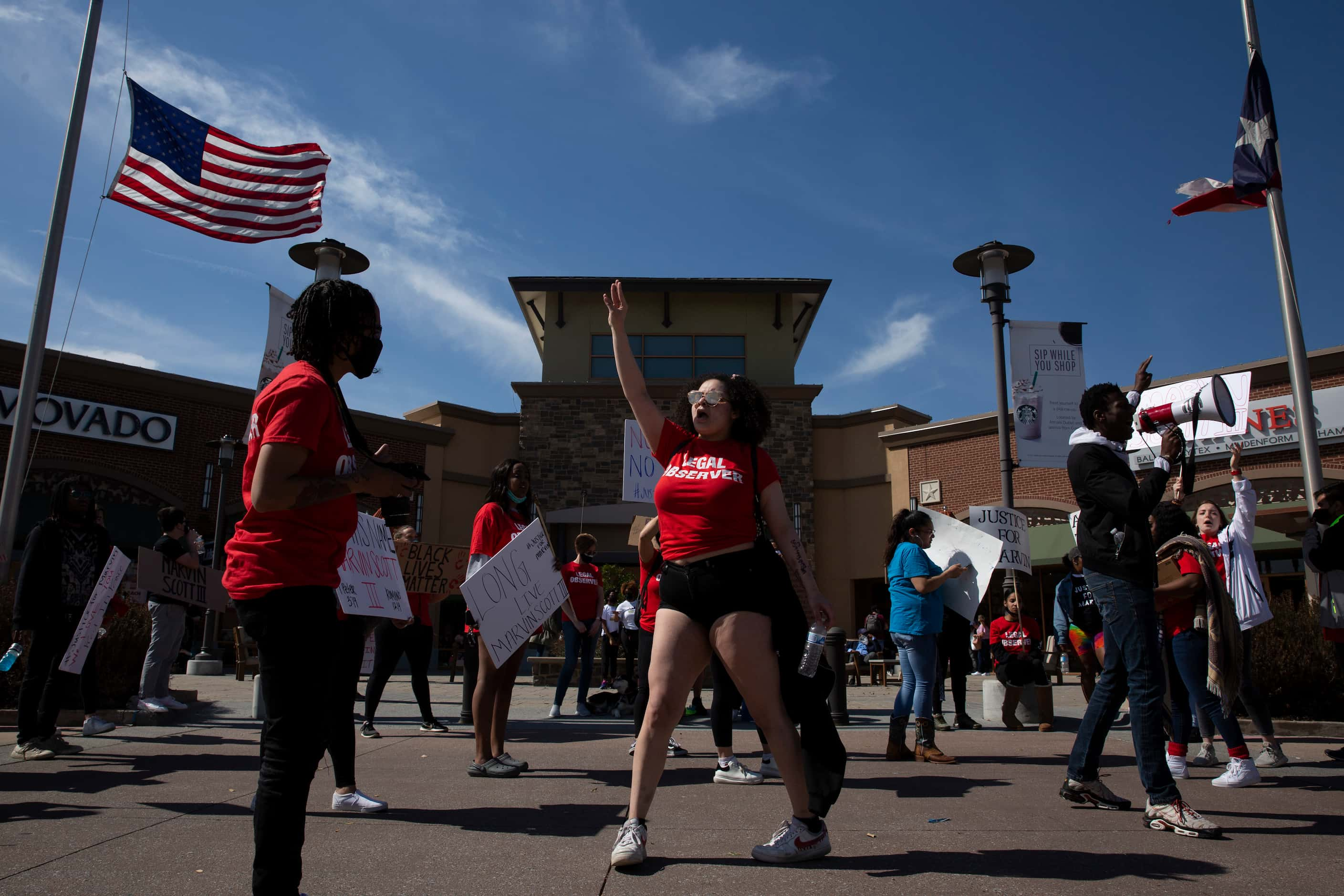 People march to the Allen Outlets on Sunday, March 21, 2021 demanding justice for Marvin...