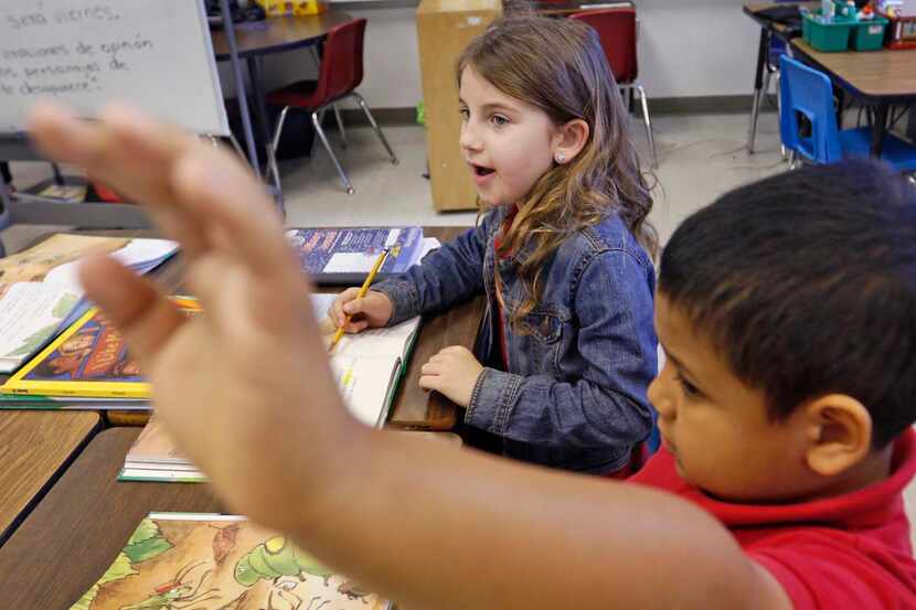 
First-grader Phoenix Hollingsworth speaks Spanish to her two-way dual-language teacher...