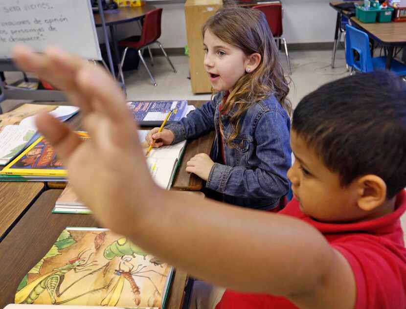 
First-grader Phoenix Hollingsworth speaks Spanish to her two-way dual-language teacher...