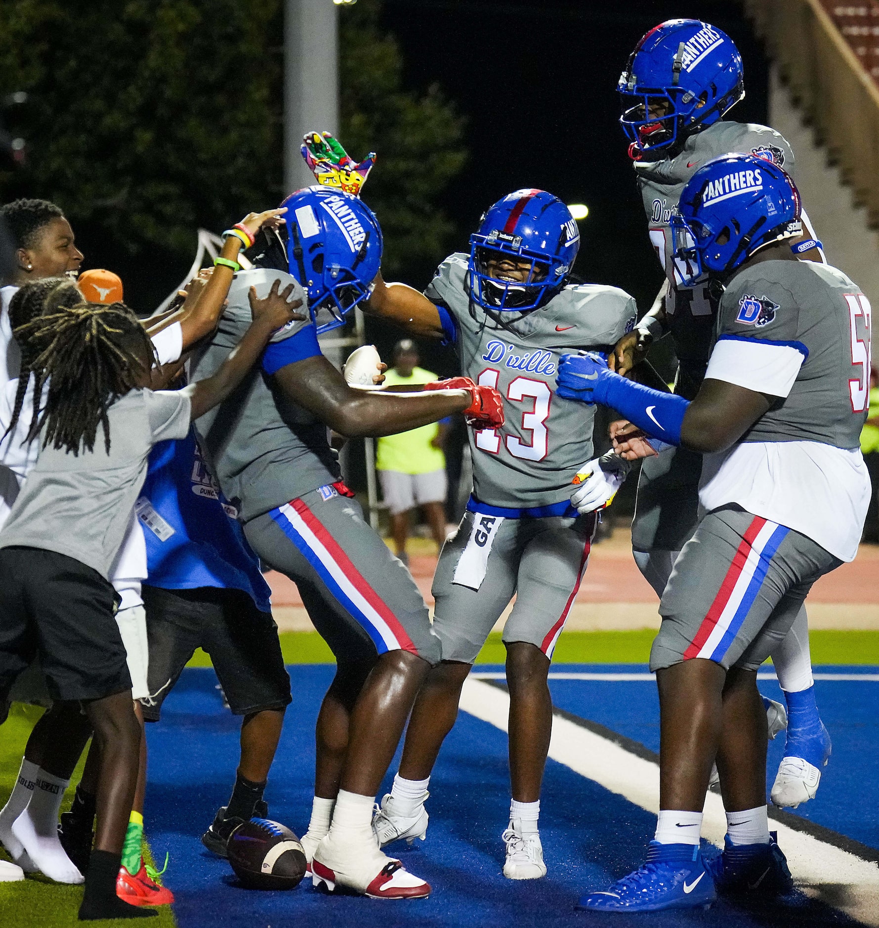 Duncanville wide receiver Zach Turner (9) celebrate with teammates after catching a 22-yard...