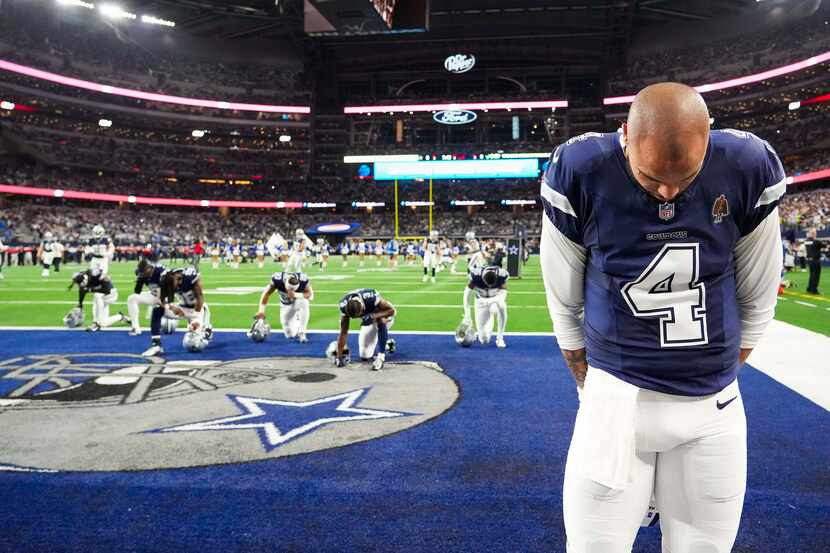 Dallas Cowboys quarterback Dak Prescott (4) stands in the end zone before an NFL football...