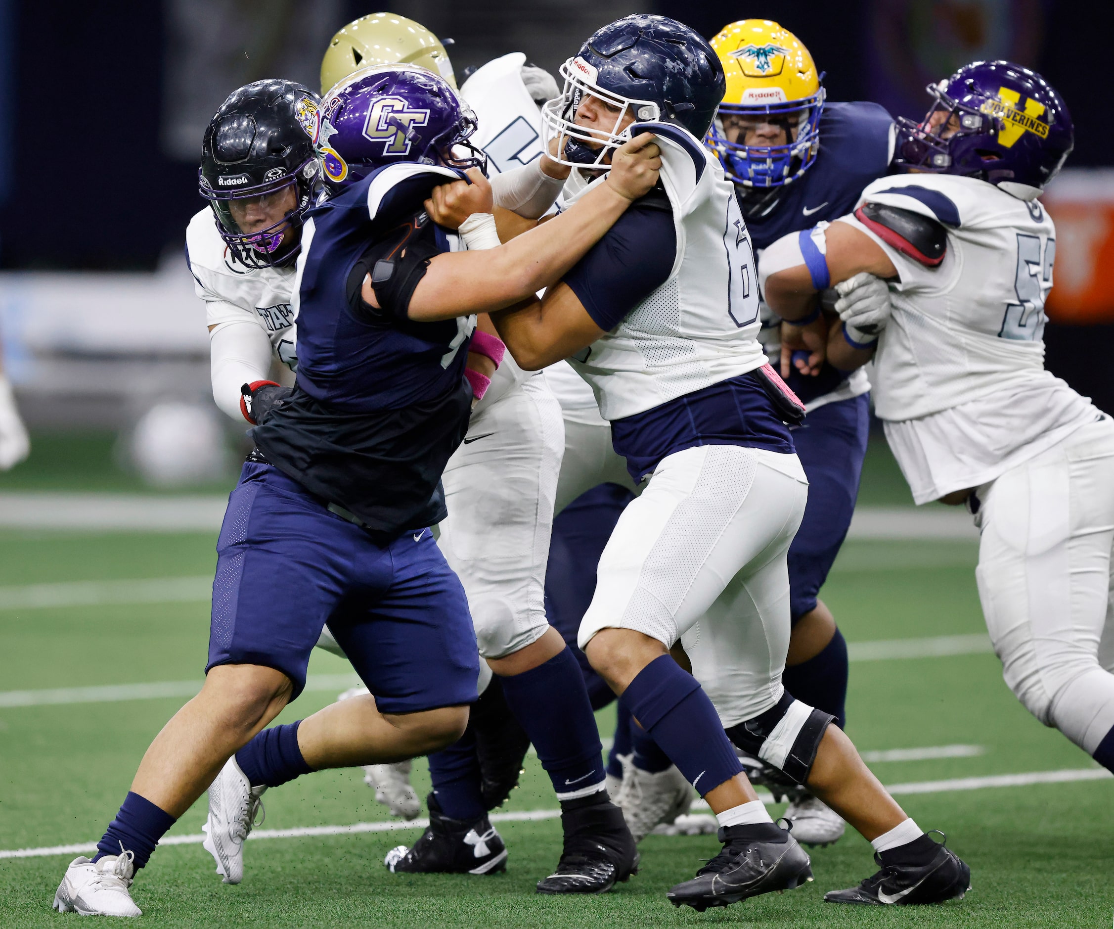 Wa-Ya defensive end Isaiah Lugo (left) of Fort Worth’s Chisholm Traill High School tries to...