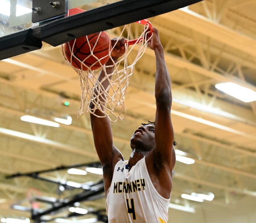 McKinney’s Ja’Kobe Walter dunks in the first half during a boys high school basketball game...