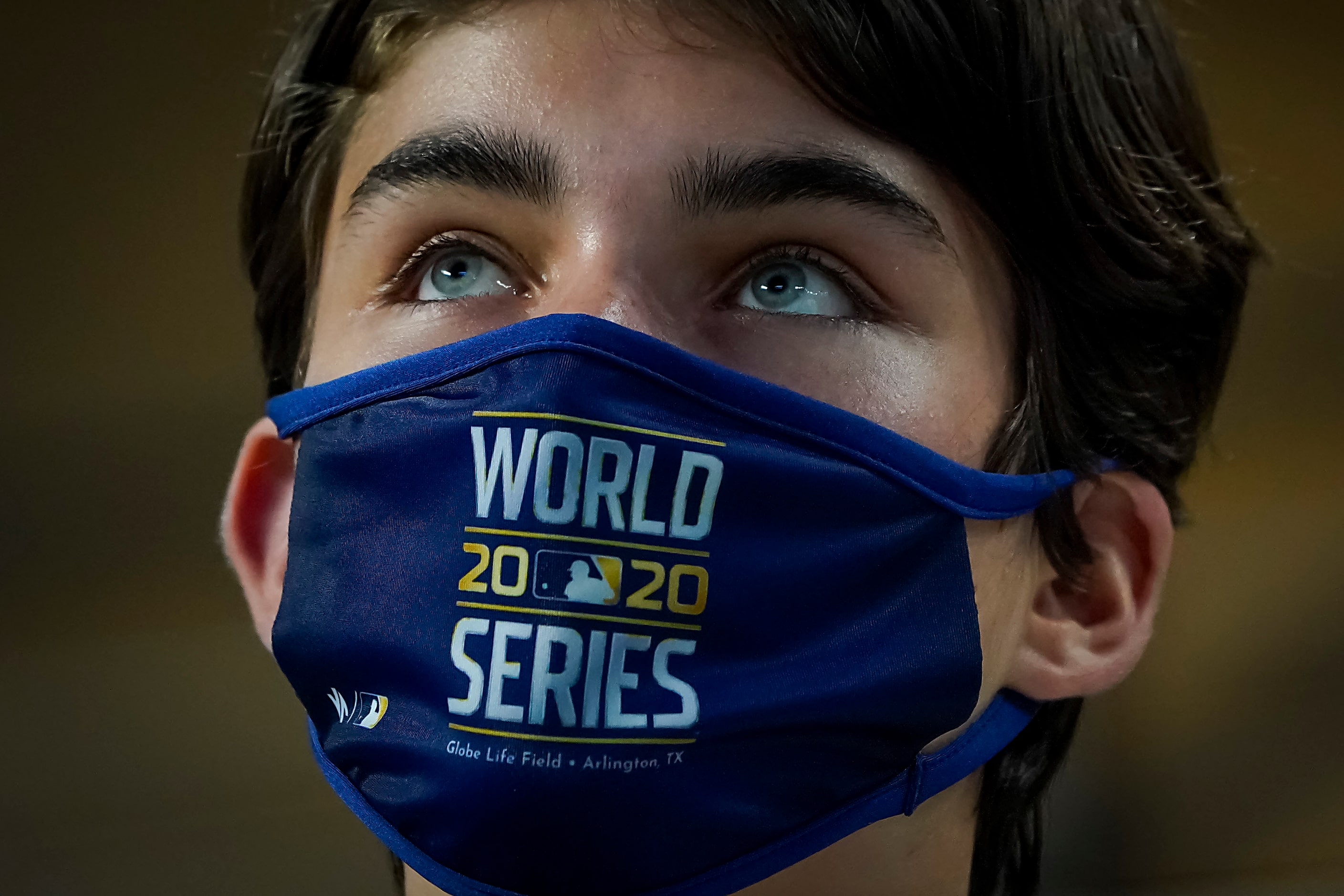 A fan wears a World Series face mask before Game 7 of a National League Championship Series...