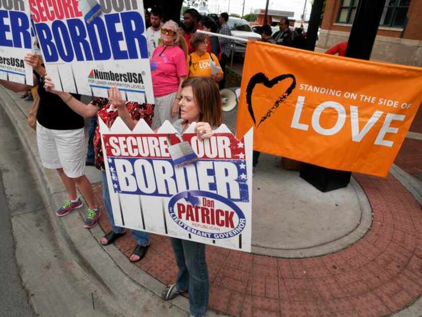 
On Friday, Sheridan King (center) and others protesting Dallas County’s plans to shelter...