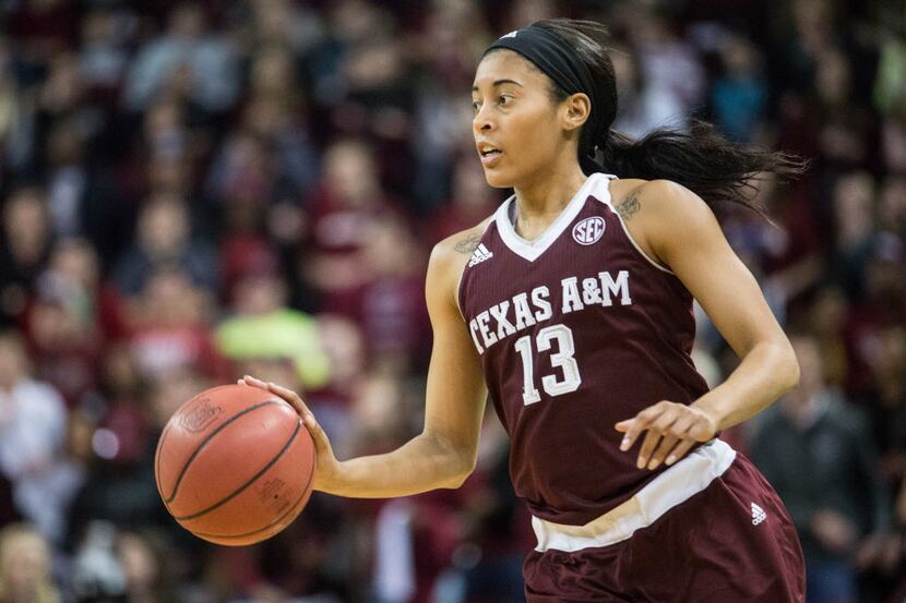 Texas A&M guard Chelsea Jennings pushes the ball downcourt during the first half of an NCAA...