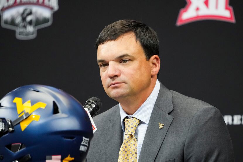 West Virginia head coach Neal Brown speaks to the press during the Big 12 Conference...