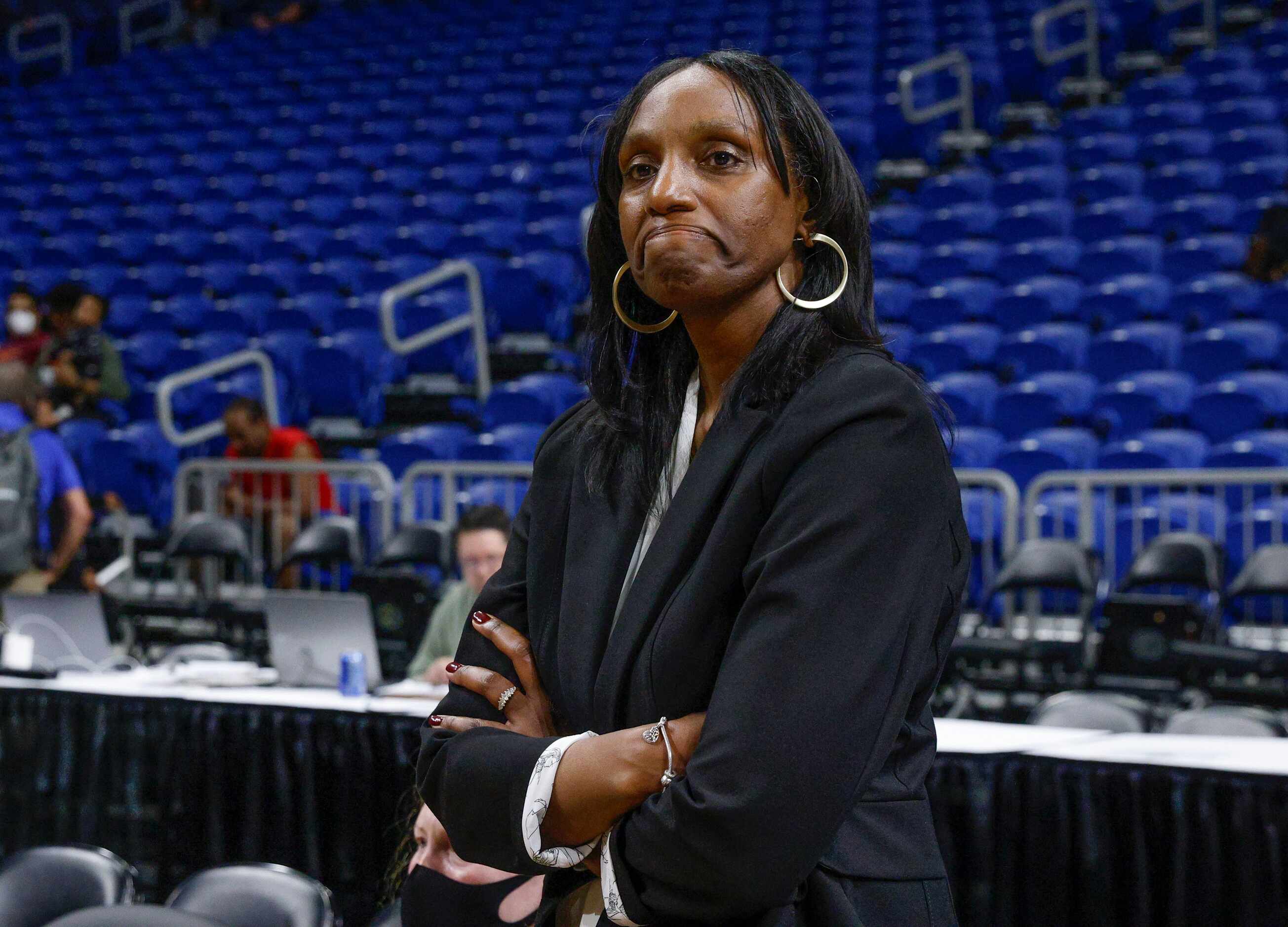 DeSoto head coach Andrea Robinson watches her team celebrate after winning the Class 6A...