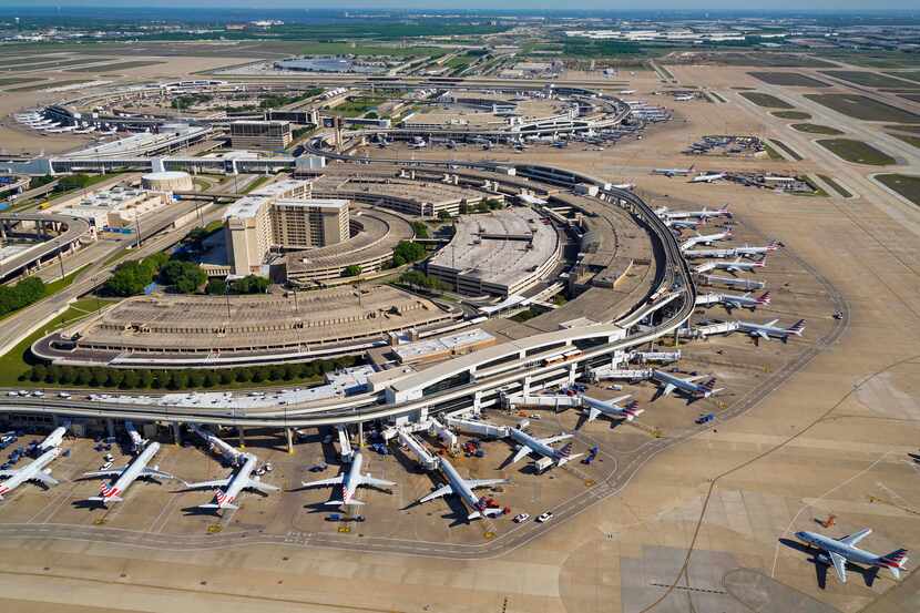 Aerial view of American Airlines aircraft at the gates of Terminal C (bottom) and Terminal A...